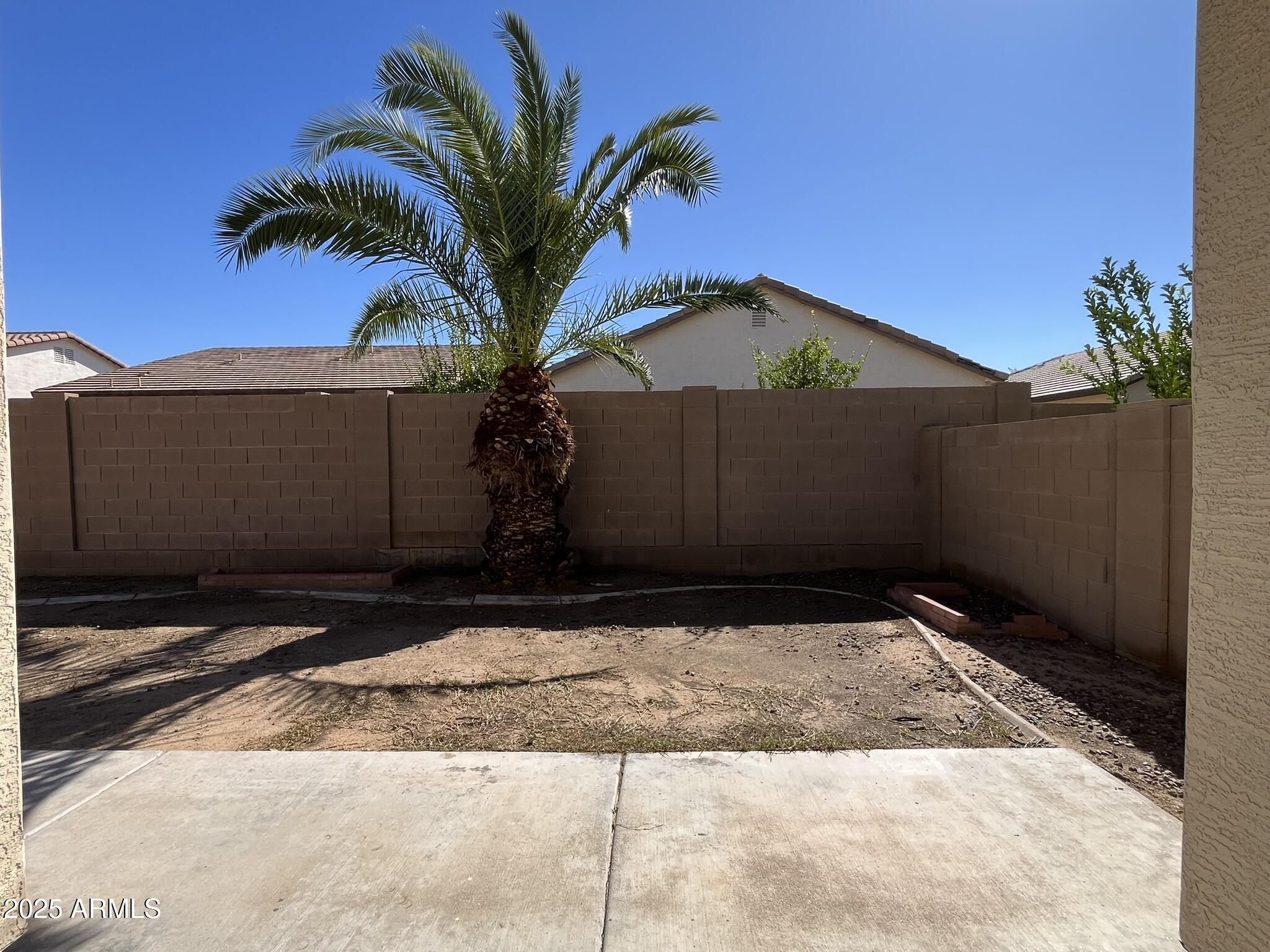 2319 West Alta Vista Road Phoenix, AZ 85041 - Photo 32 of 43 a view of a house with a yard