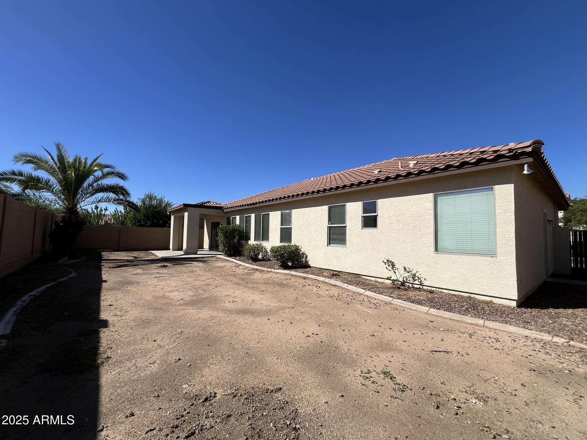 2319 West Alta Vista Road Phoenix, AZ 85041 - Photo 35 of 43 a view of a house with a patio
