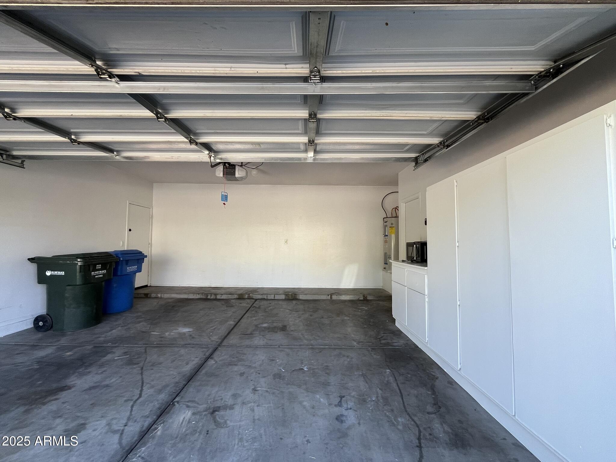 2319 West Alta Vista Road Phoenix, AZ 85041 - Photo 36 of 43 a view of a room with racks on the wall