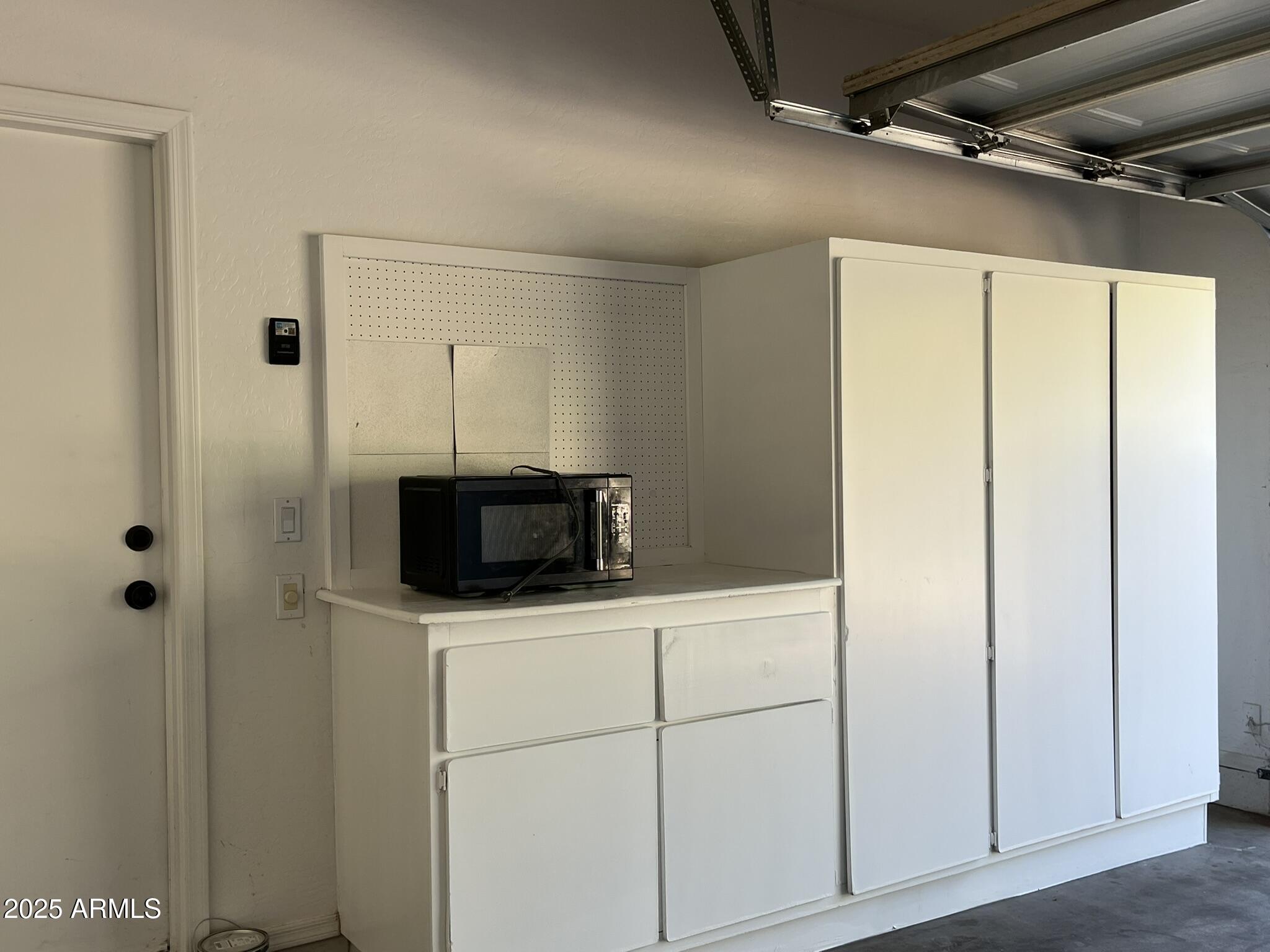 2319 West Alta Vista Road Phoenix, AZ 85041 - Photo 38 of 43 a bathroom with a sink and a mirror