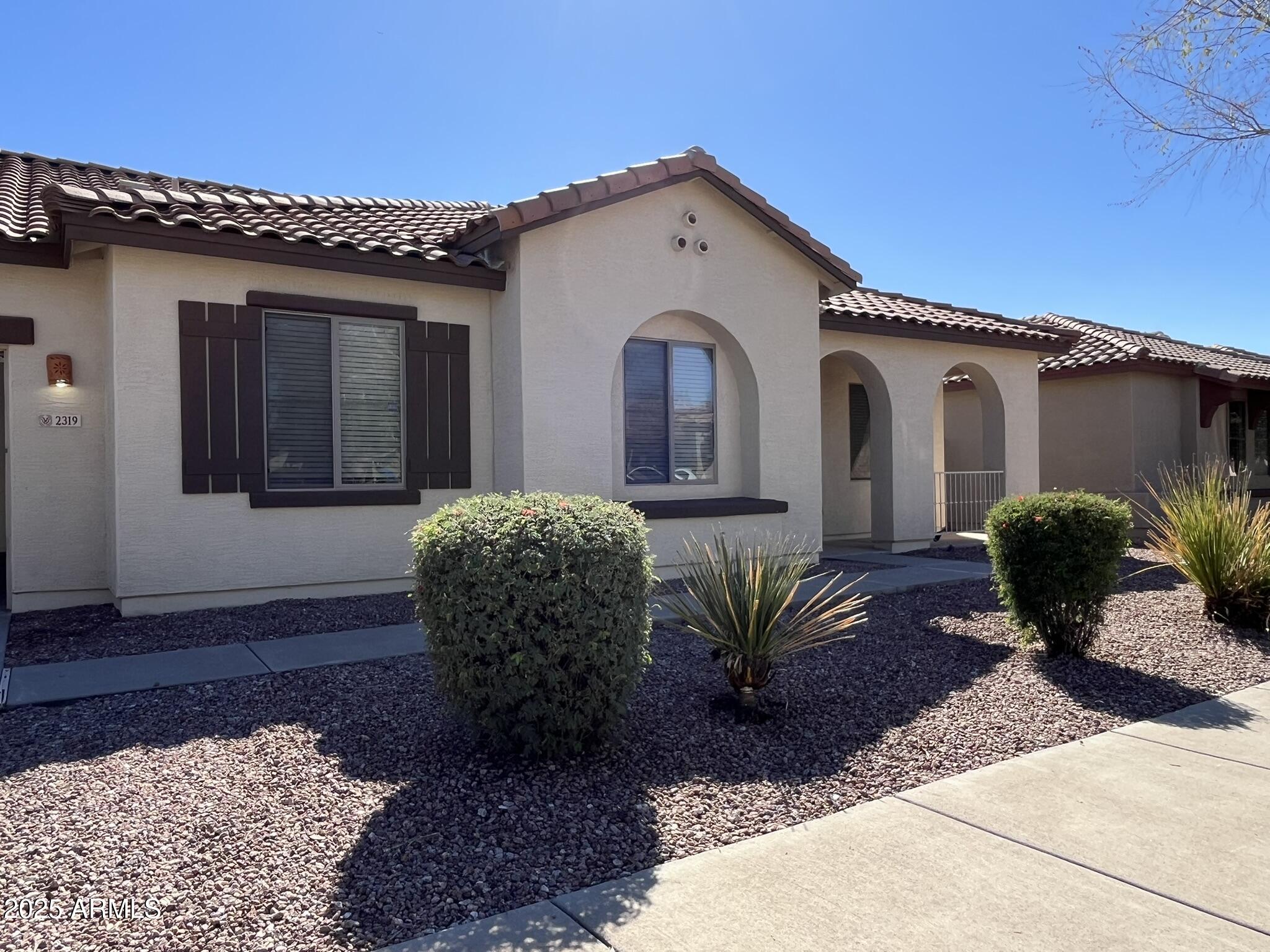 2319 West Alta Vista Road Phoenix, AZ 85041 - Photo 41 of 43 a front view of a house with garden