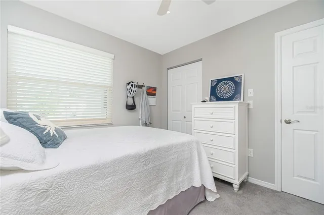 a bedroom with a bed and a cabinets