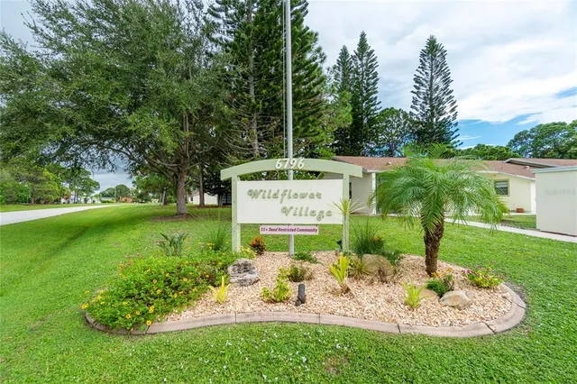 a view of a park with welcome board