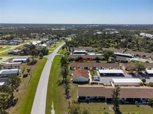an aerial view of a house with a swimming pool