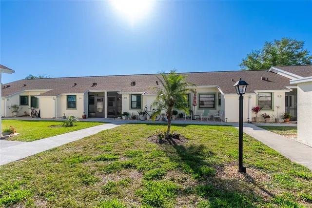 a view of house with outdoor space and swimming pool
