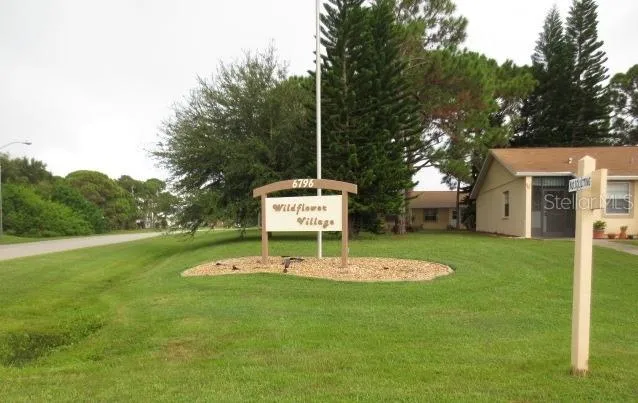 a view of a table and chairs in the garden