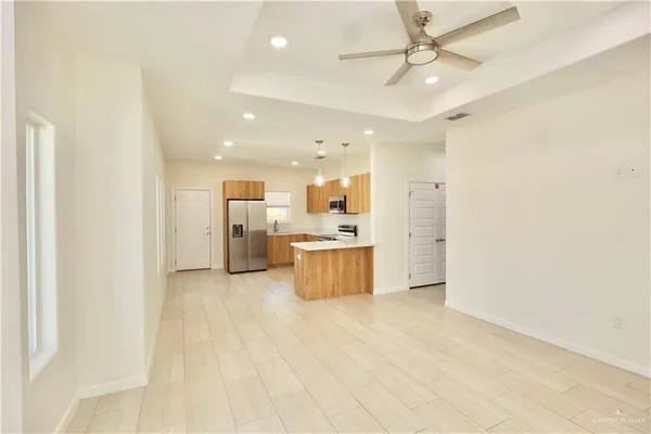 a large kitchen with a lot of white cabinets