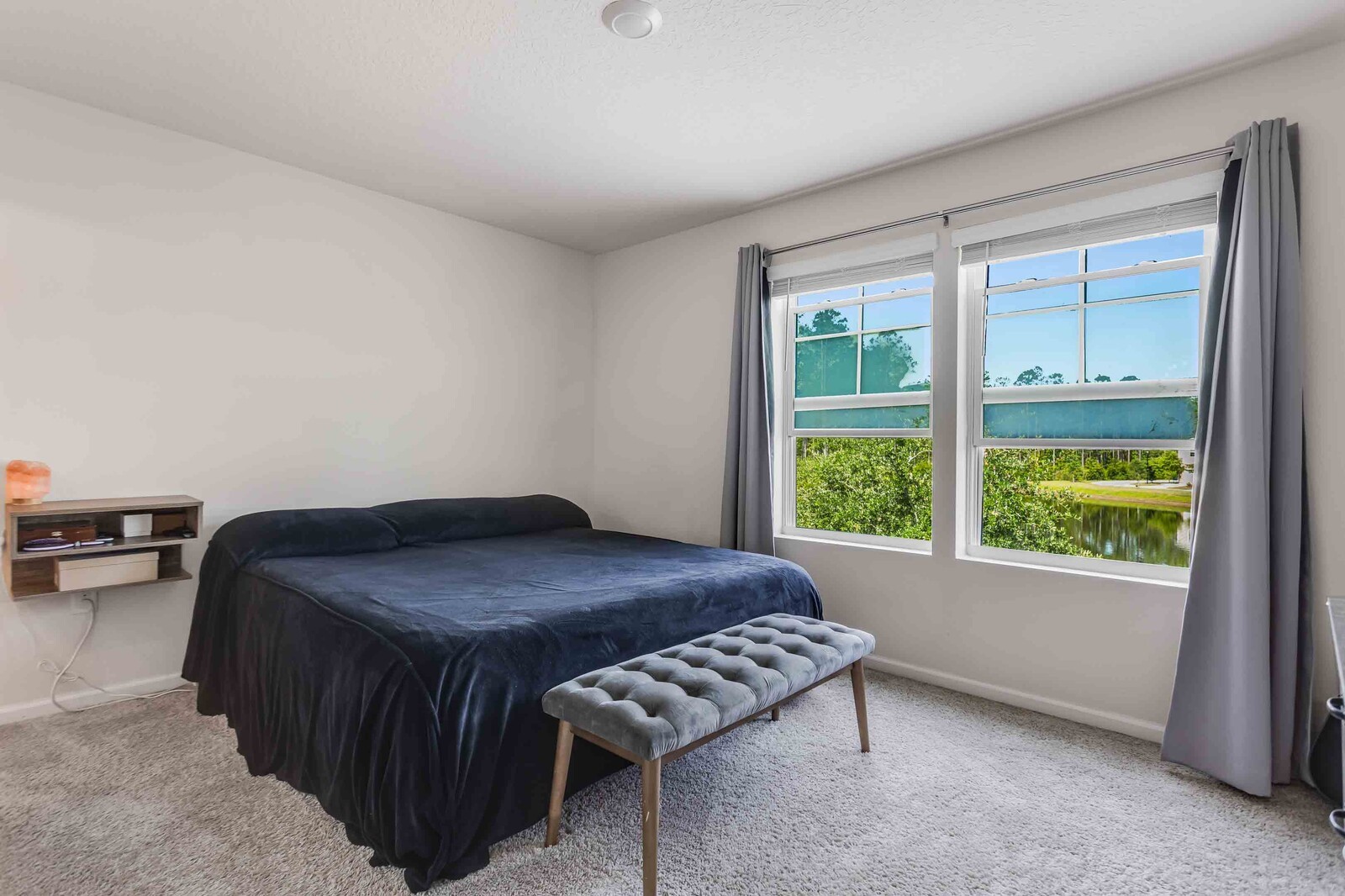 86784 Mainline Road Yulee, FL 32097 - Photo 8 of 25 a bedroom with a bed and a window