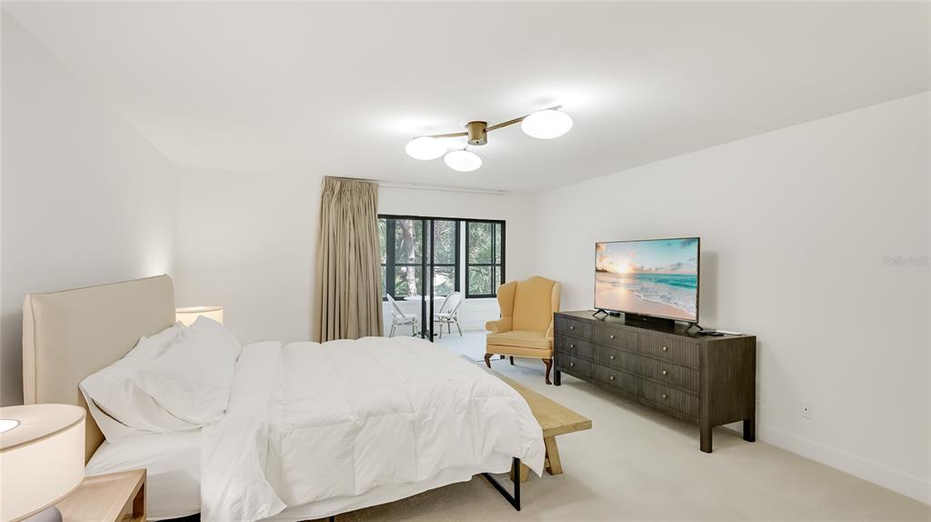 303 Springdale Drive, Unit 303 Bradenton, FL 34210 - Photo 14 of 23 a bedroom with a bed furniture and a window