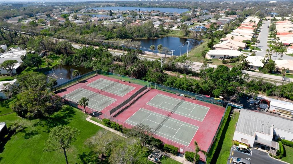 303 Springdale Drive, Unit 303 Bradenton, FL 34210 - Photo 23 of 23 an aerial view of a houses with a yard