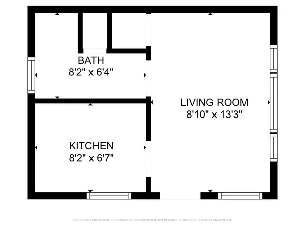 a picture of a bench in front of a gate