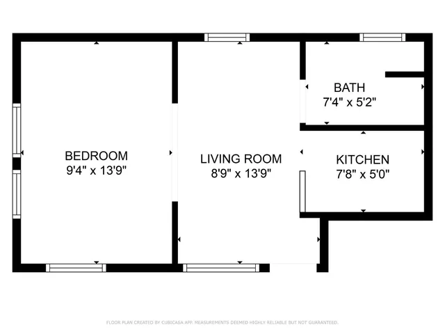 a picture of a bench in front of a white house
