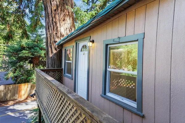 a front view of a house with wooden fence