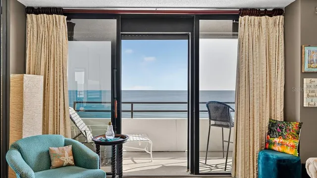 a view of a livingroom with furniture and windows