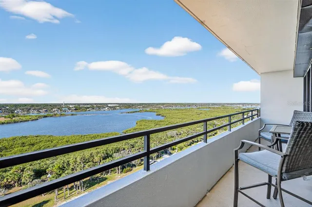a view of swimming pool with outdoor seating