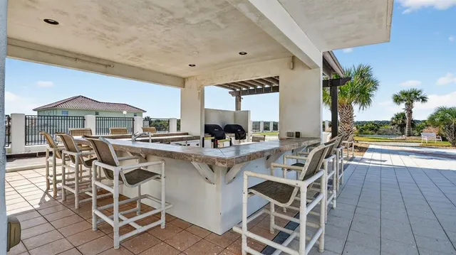 a view of a dining table and chairs in the patio