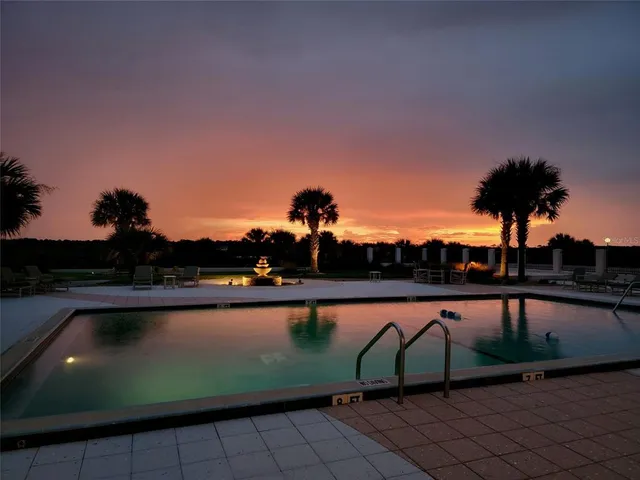 a view of swimming pool from a balcony