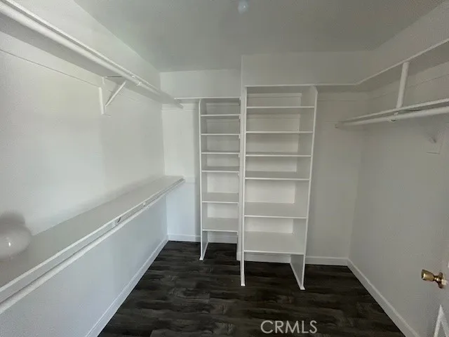 a room with a hardwood and a window