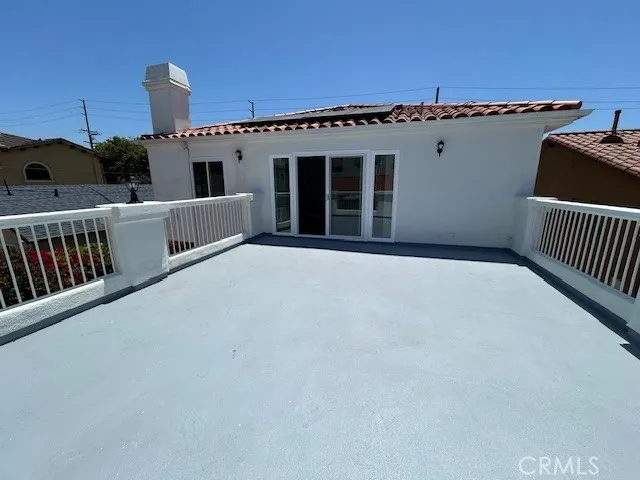 a view of a balcony with furniture