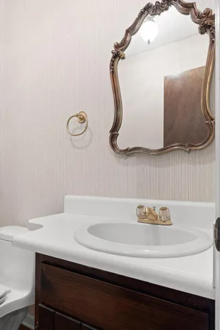 a bathroom with a sink and a mirror