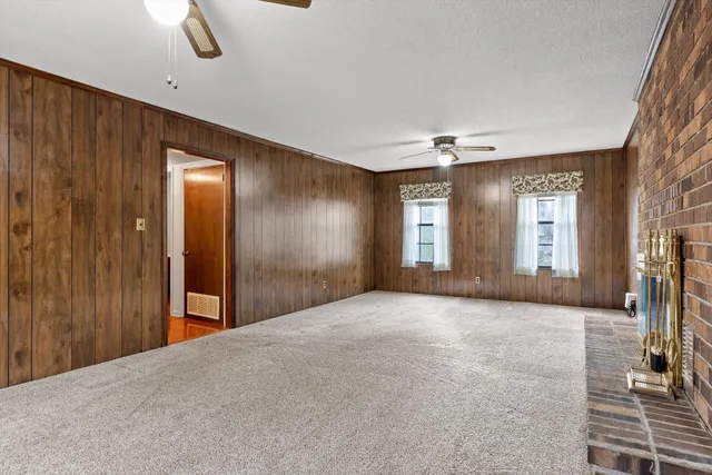 a view of livingroom with hardwood floor and ceiling fan