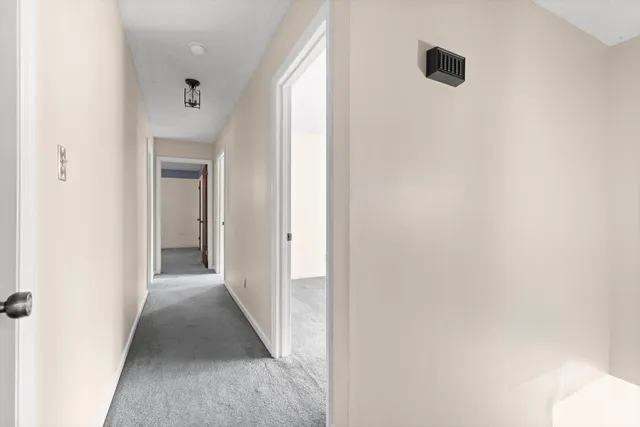 a view of a hallway with shower