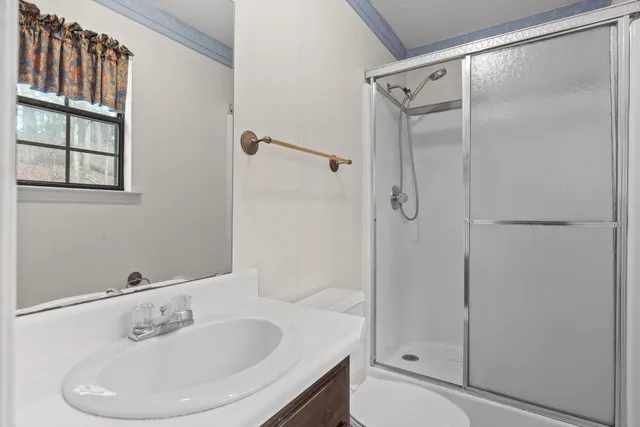 a bathroom with a sink and shower