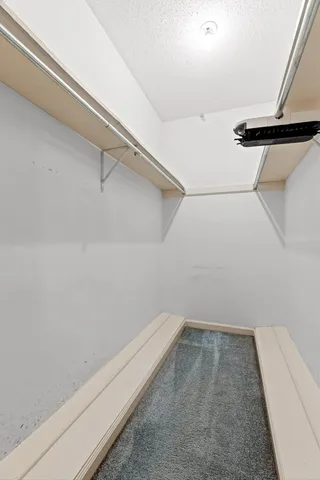 a view of a room with racks on the wall