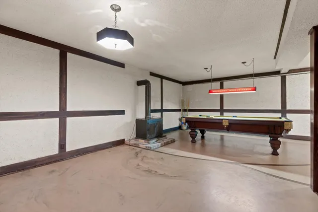 a view of game room with windows