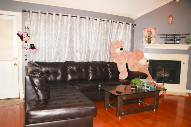 a living room with furniture and a fireplace