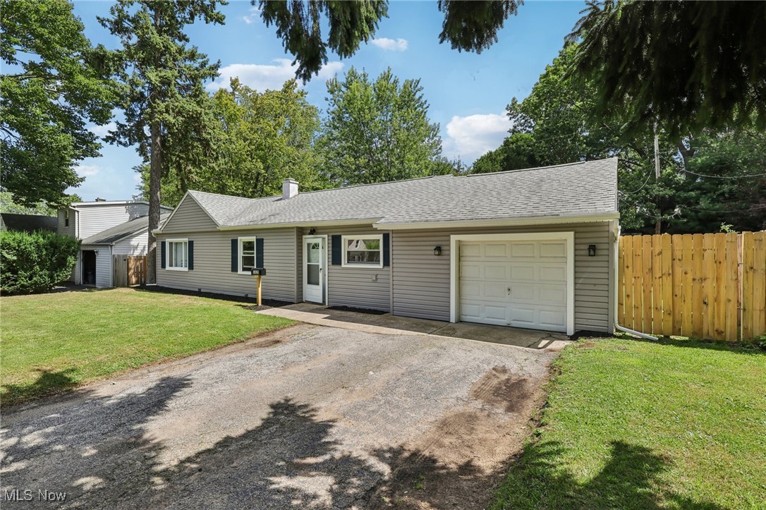 1829 Clyde Road Madison, OH 44057 - Photo 4 of 40 Ranch-style home featuring a garage and a front yard