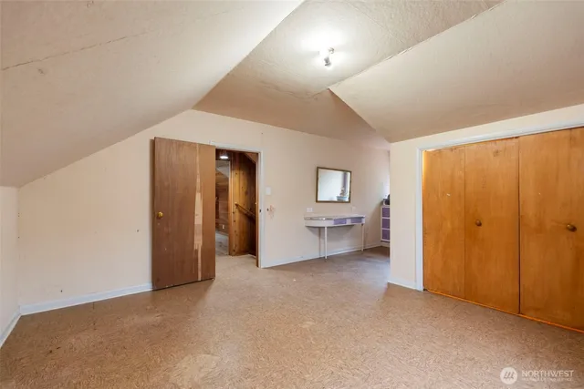 a view of a livingroom with a furniture and a bathroom
