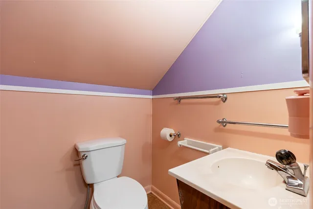 a bathroom with a sink a toilet and a shower