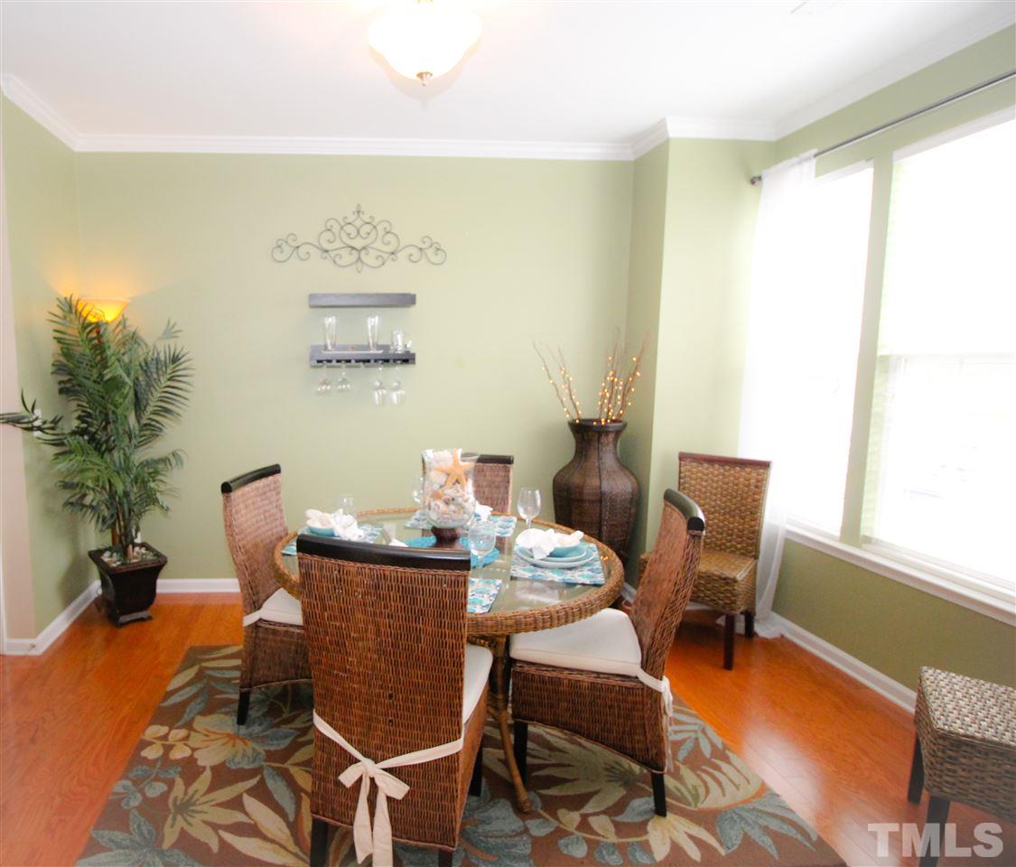 7757 Winners Edge Street Raleigh, NC 27617 - Photo 2 of 24 Dining Room is spacious and very open! Light, bright and airy with tons of windows! Hardwood floors!
