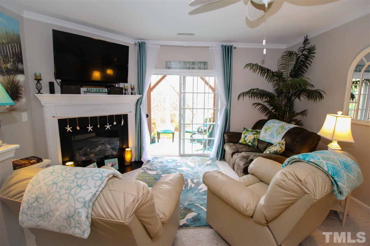 7757 Winners Edge Street Raleigh, NC 27617 - Photo 13 of 24 The Family Room is on the lower level! Again, with the calming paint colors and beachy decor, sweet aromas flowing, water fountain running, this home is like a beach retreat!