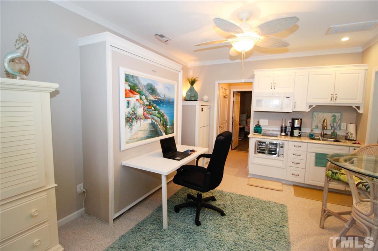 7757 Winners Edge Street Raleigh, NC 27617 - Photo 19 of 24 Here is the Murphy Bed in the desk position! The desk simply detaches and gets stored away until needed again!