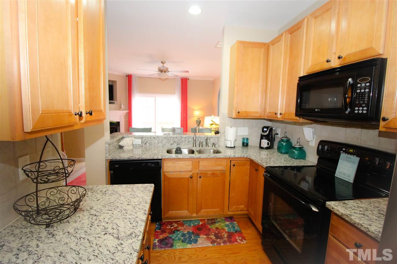 7757 Winners Edge Street Raleigh, NC 27617 - Photo 3 of 24 The Kitchen is a great layout, perfect for the chef! Plenty of counter and cabinet space! Hardwood floors and stainless appliances! Breakfast bar is perfect spot for the kiddos to sit and do homework while dinner is being made!