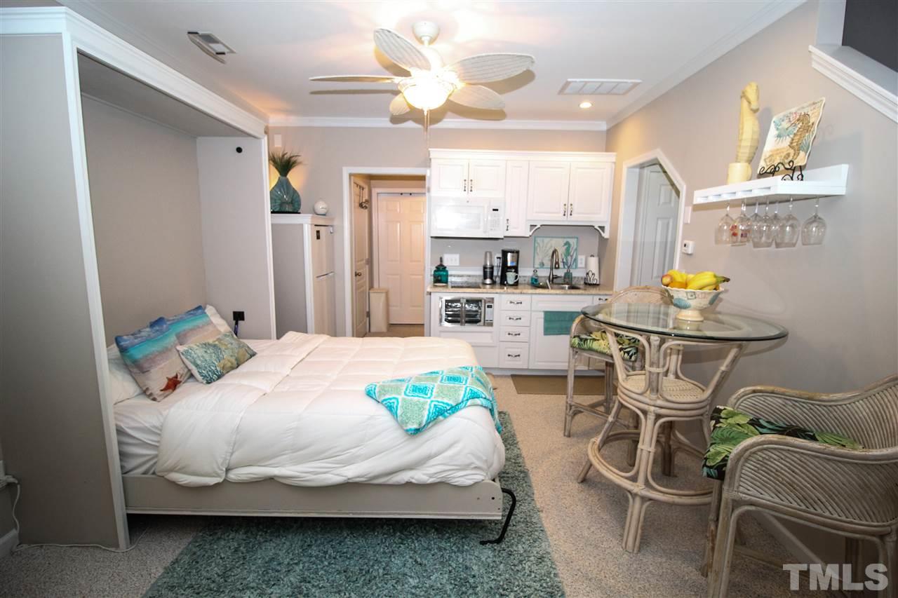 7757 Winners Edge Street Raleigh, NC 27617 - Photo 20 of 24 Here is another view of the Murphy Bed in position! Such a smart idea these sellers had! It is such a quaint and peaceful space! Perfect for your in laws, guests or even your teen!