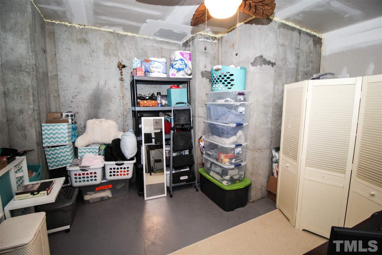 7757 Winners Edge Street Raleigh, NC 27617 - Photo 21 of 24 Here is the ample storage space on the lower level!
