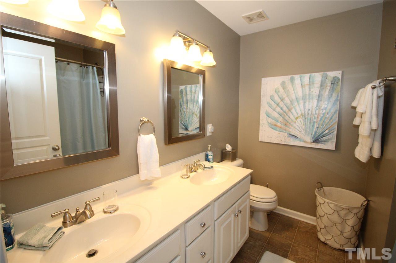 7757 Winners Edge Street Raleigh, NC 27617 - Photo 9 of 24 The Master Bath has dual vanities, garden tub, calming paint colors and decor, ample cabinet space!