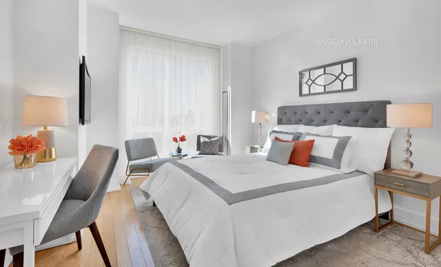 a bed room with a bed and a chair