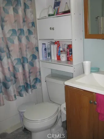 a close view of a bathroom sink with wooden floor