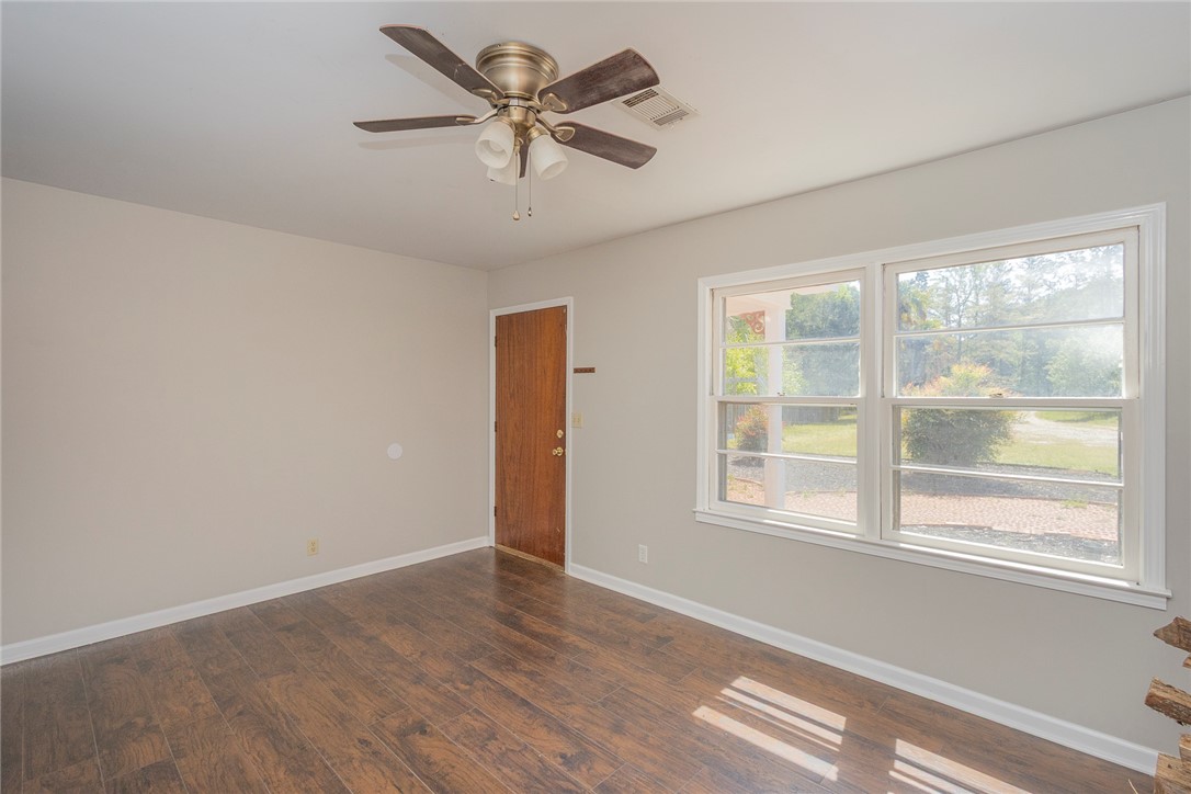 820 Travis Road Anderson, SC 29626 - Photo 15 of 46 This bright room features durable flooring, ample natural light, and a refreshing ceiling fan.