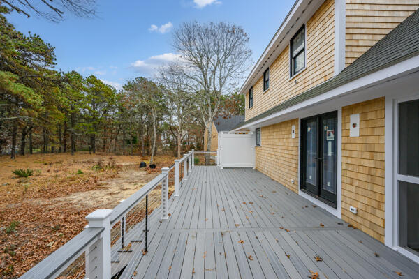 20 Billingsgate Avenue Eastham, MA 02642 - Photo 9 of 21 a view of a house with wooden deck