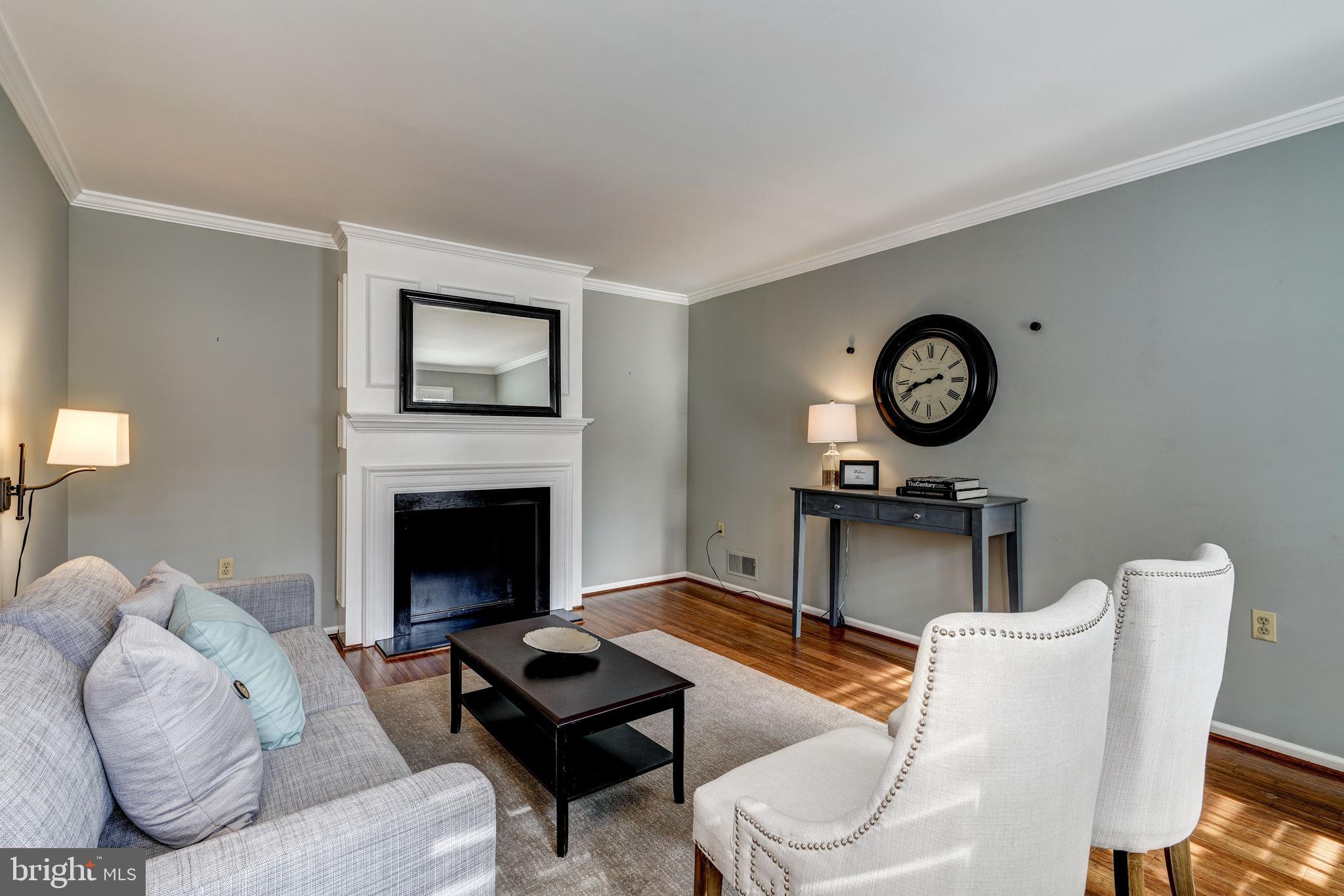 Formal living room with faux fireplace