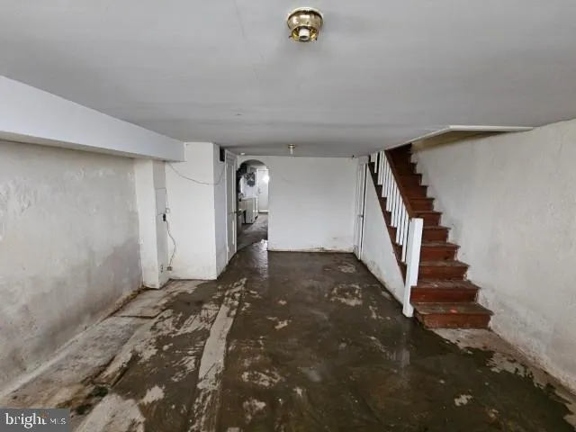 a view of a livingroom with stairs