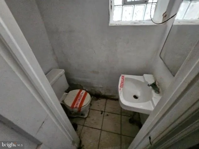 a bathroom with a toilet and a sink
