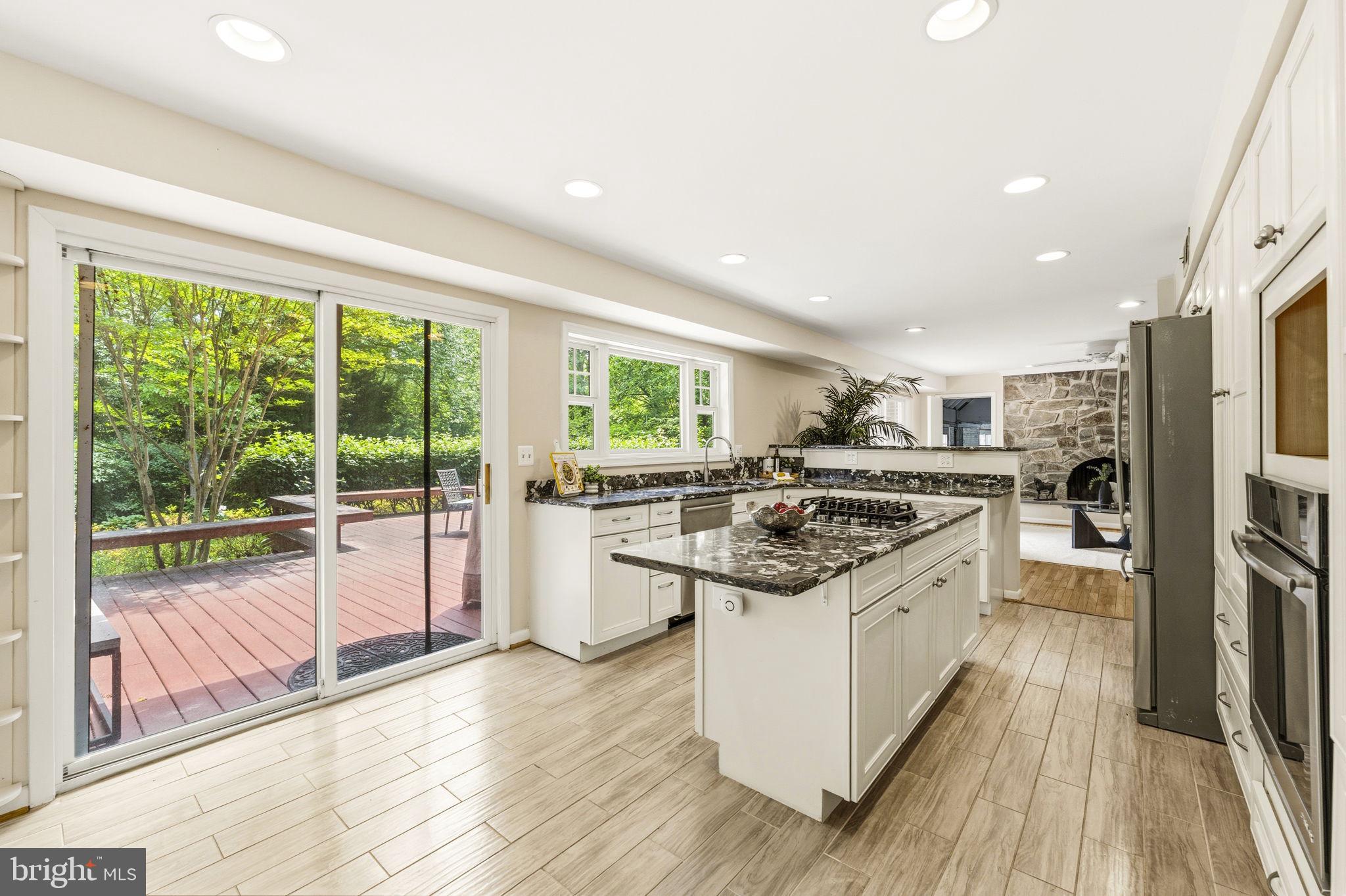 8566 Brickyard Road Potomac, MD 20854 - Photo 14 of 55 Bright, airy kitchen with nature views.