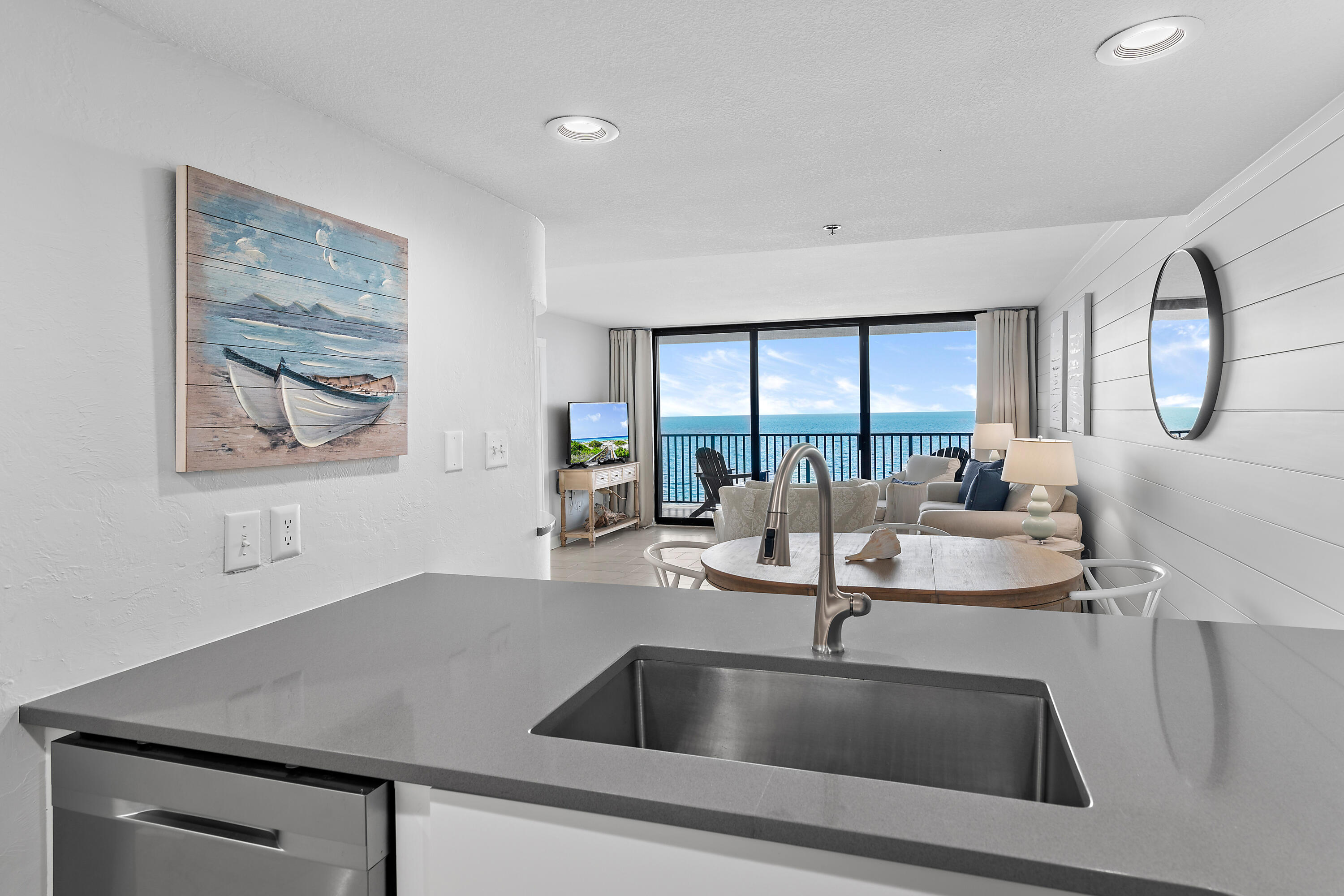 4100 East County Highway 30A, Unit 1805 Santa Rosa Beach, FL 32459 - Photo 11 of 35 a kitchen with a sink and a painting on the wall