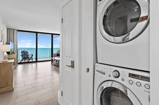 a view of a hallway with washer and dryer